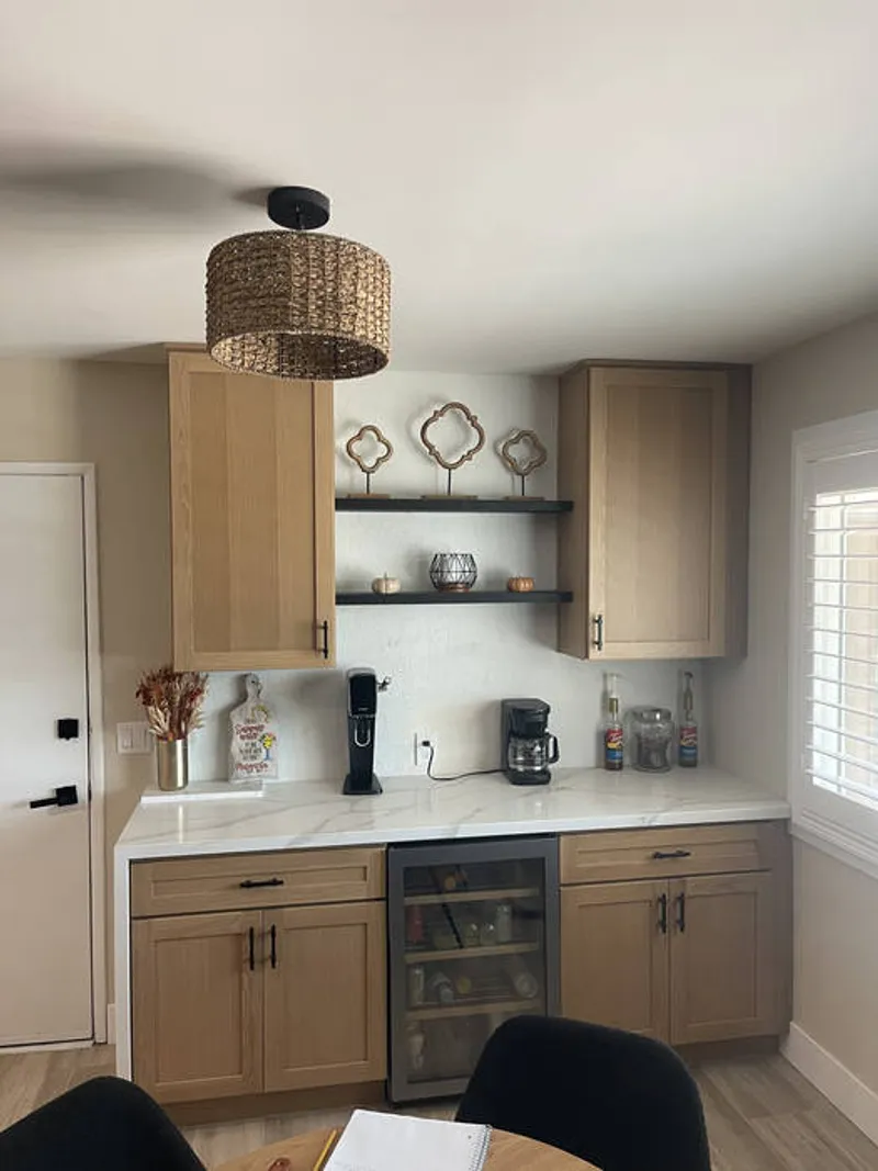 Walk-in closet built-in with adjustable shelving and LED lighting by First Class WoodWorks Murrieta